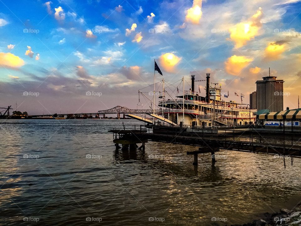 The Riverboat Paddle Wheel Steamer Natchez On The Mississippi River With The Greater New Orleans Bridges In View