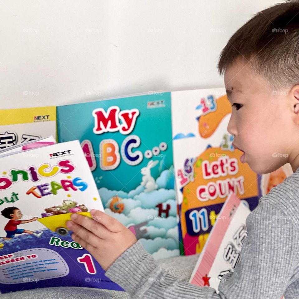 Asian Preschooler with books 