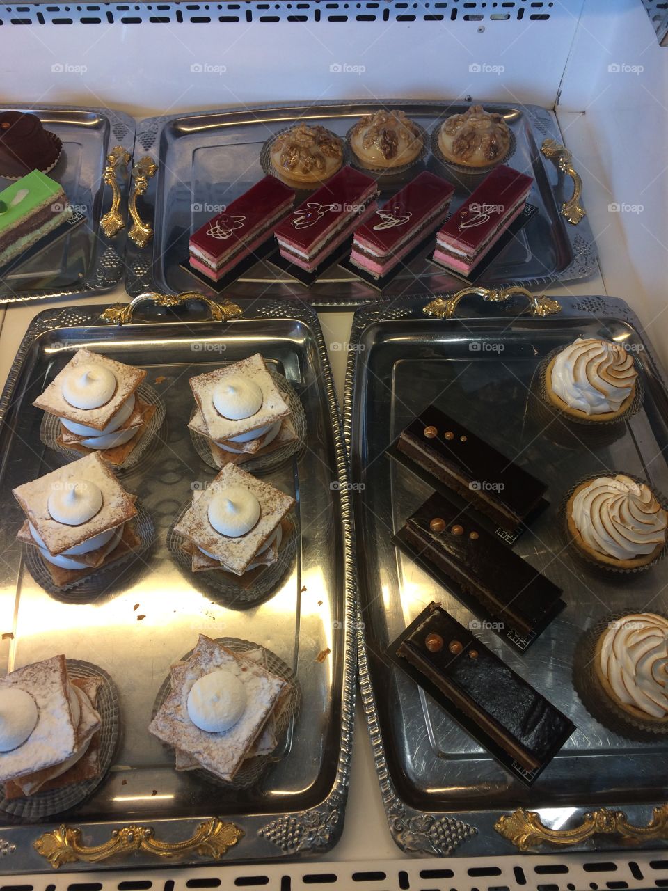 Display of sweet cakes on bakery shop