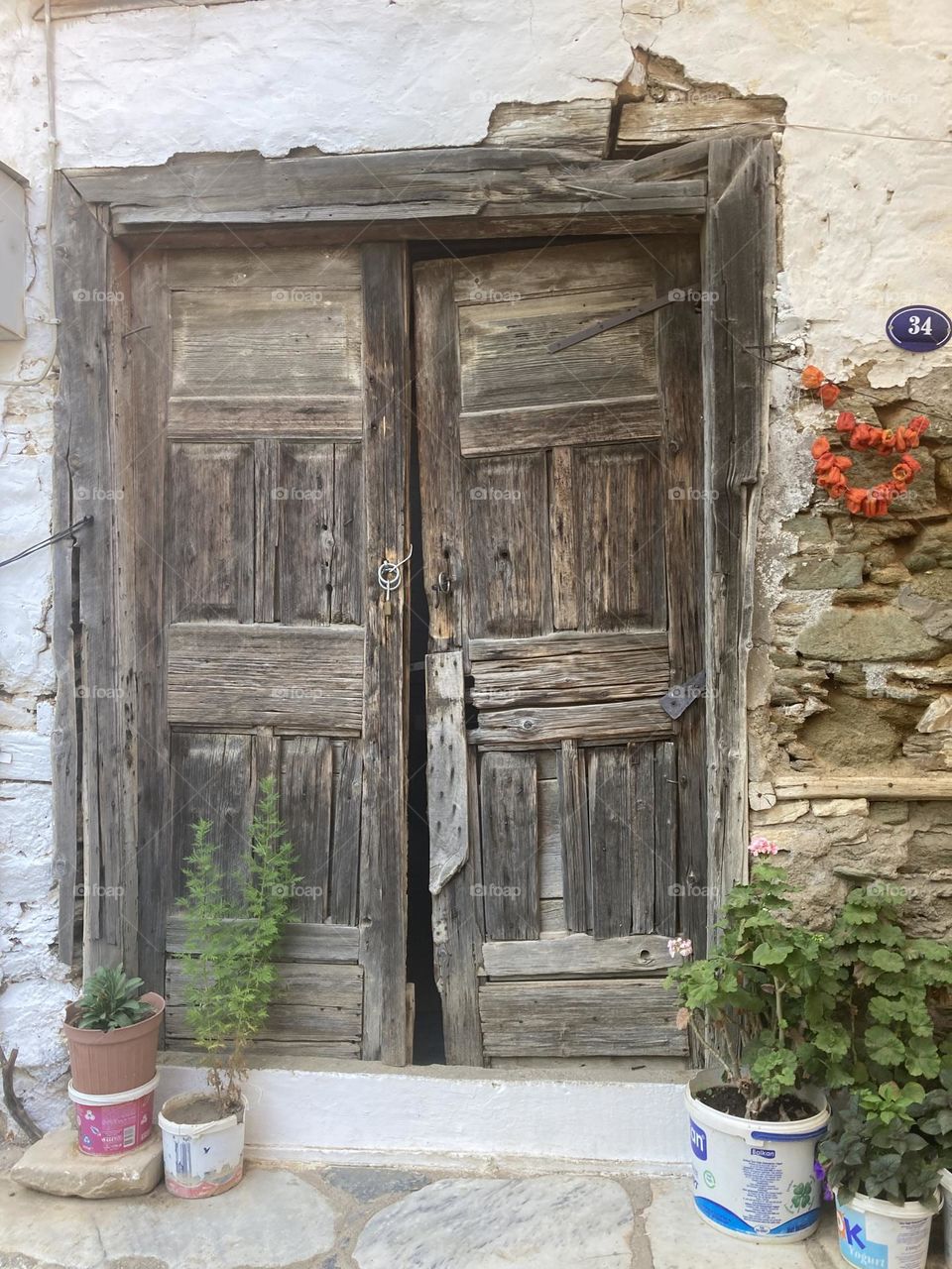 Greek village in Turkey. Blue sky and tall palm trees. Sunsets and sunny days. Summertime in Kusadasi. Vacation travel in Turkey . Summer view. Sunny day during vacation. Hidden gems and secret places.
