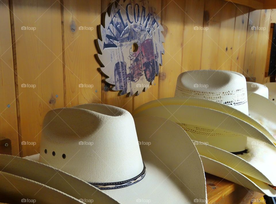 Close-up of white cowboy hats