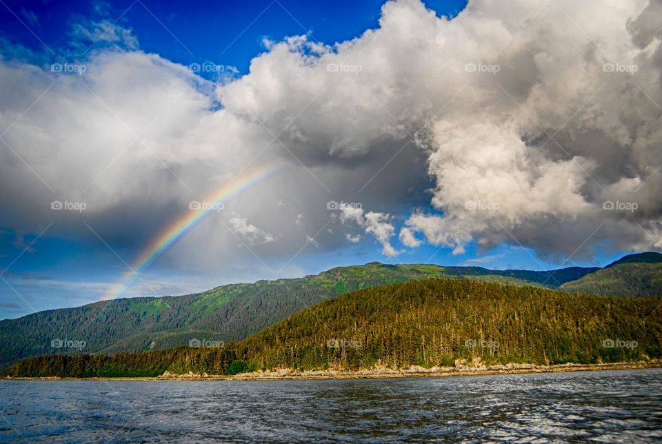 Rainbow over mountain in Alaska 