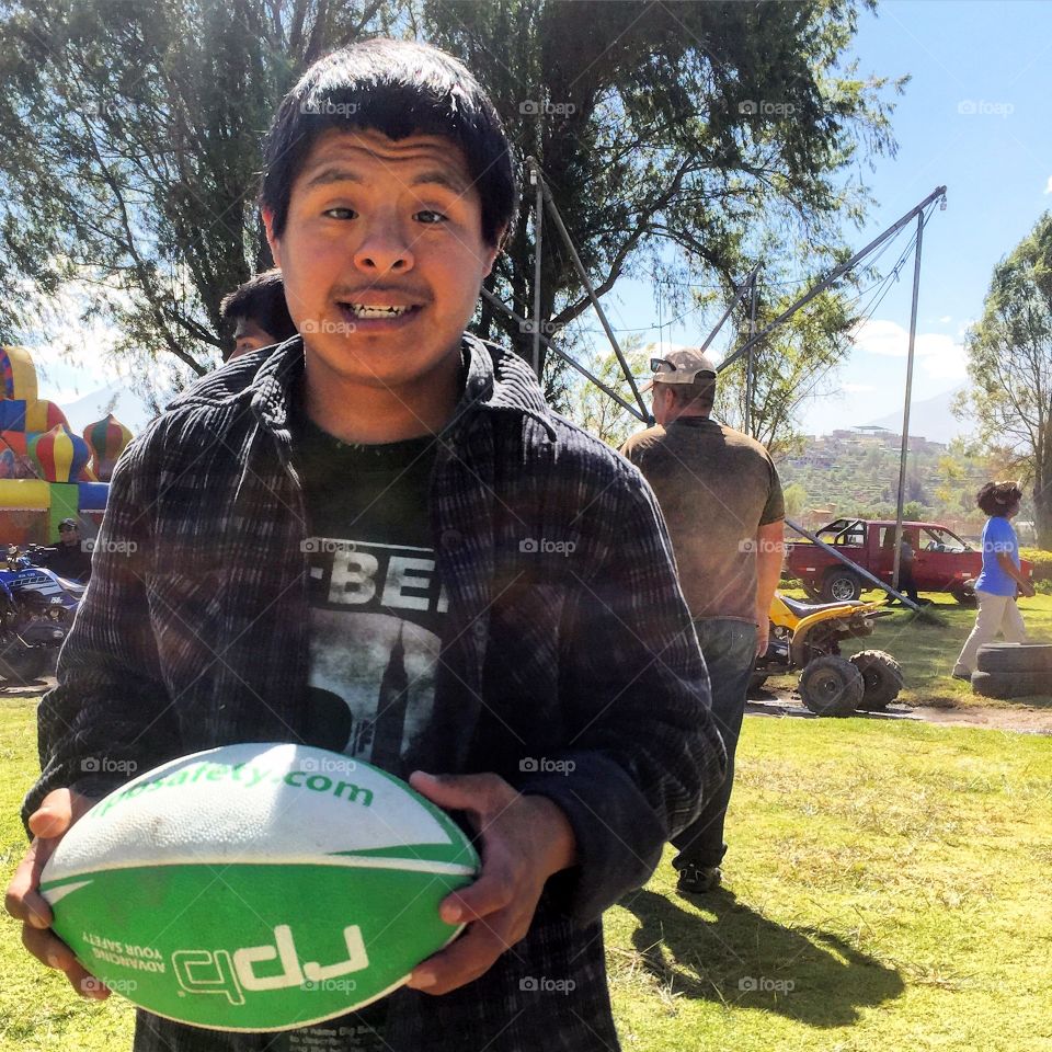 Andres was proud to received a football from a charity group in Peru. Little orphan Andres has down syndrome but nothing can stop him from being happy.