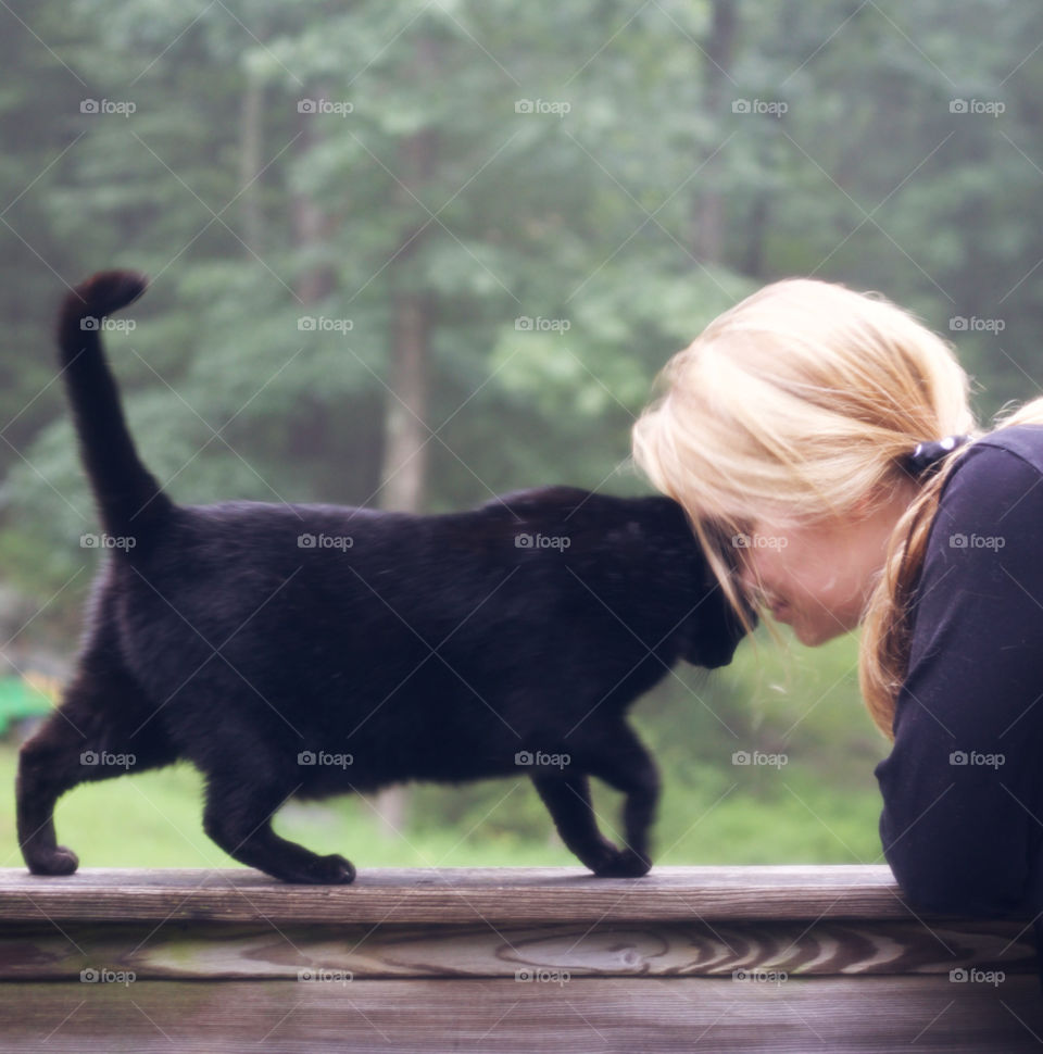 Love Touch; Cat showing admiration for woman with a “head press.” 