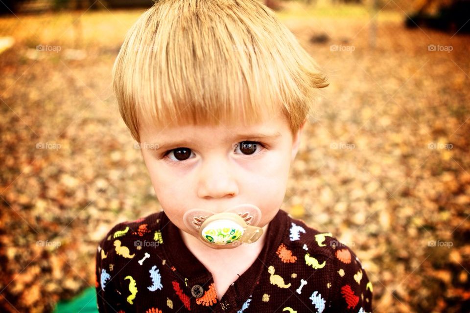 Little boy with pacifier.