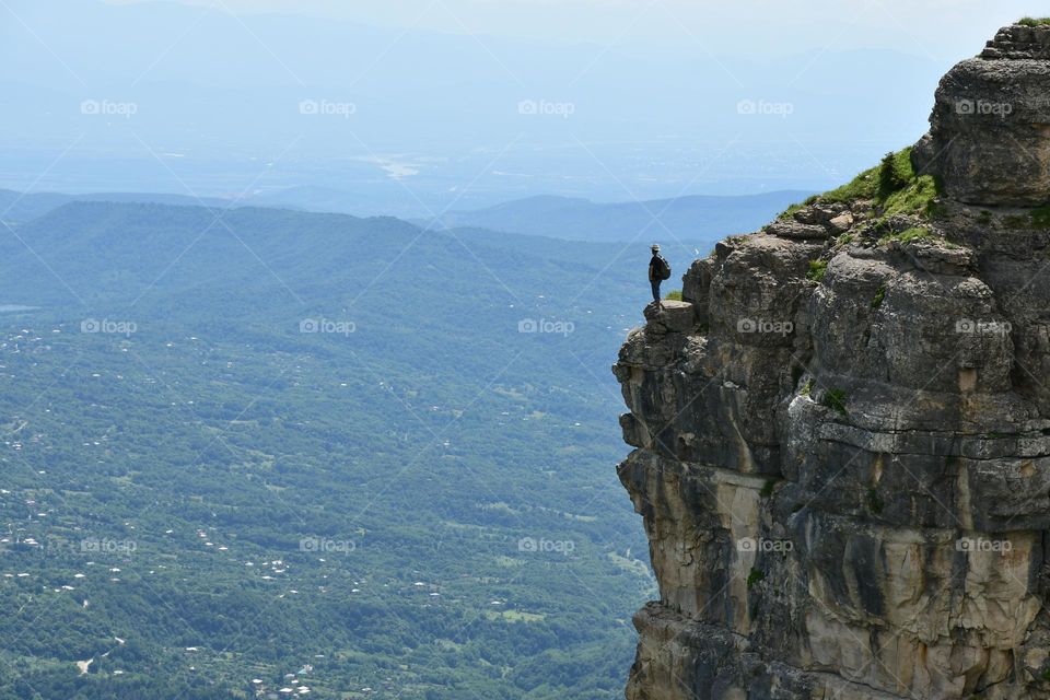 Hiker on a cliff in Georgia 