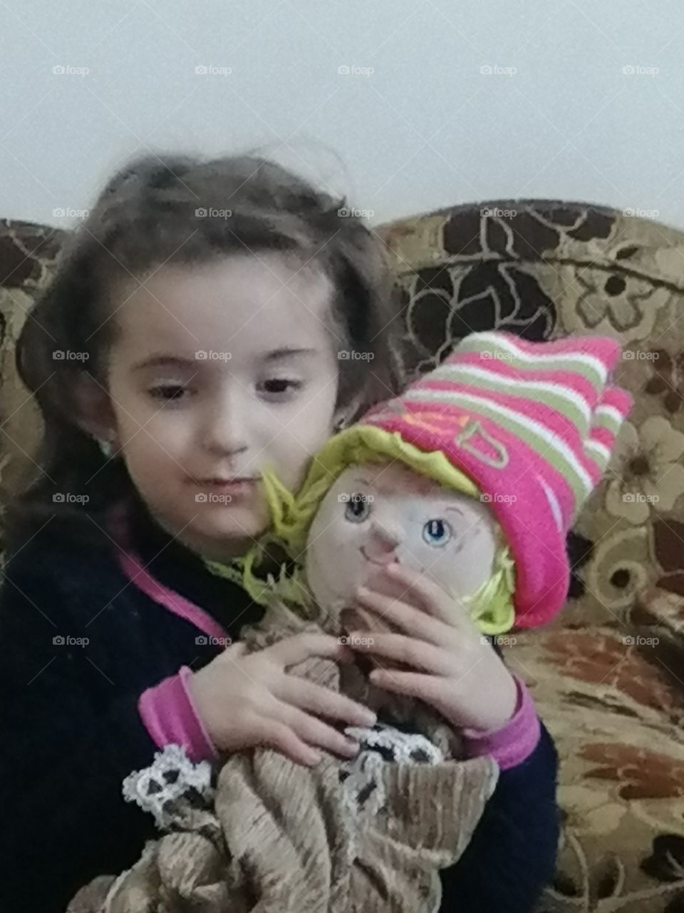 A girl and a doll