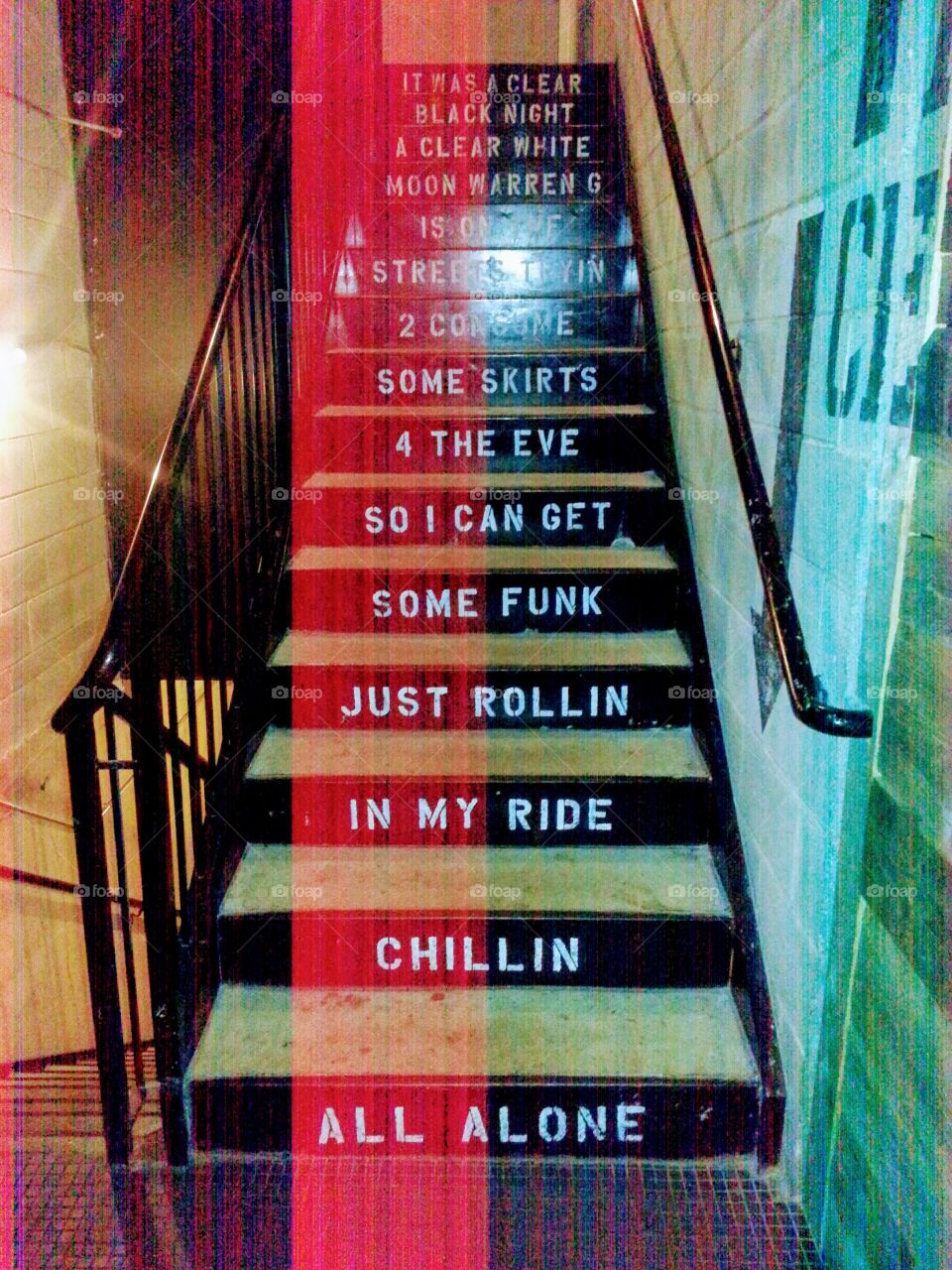 Stairs with Warren G "Regulate" lyrics on stairs at Punch Bowl Social in Schaumburg, Illinois