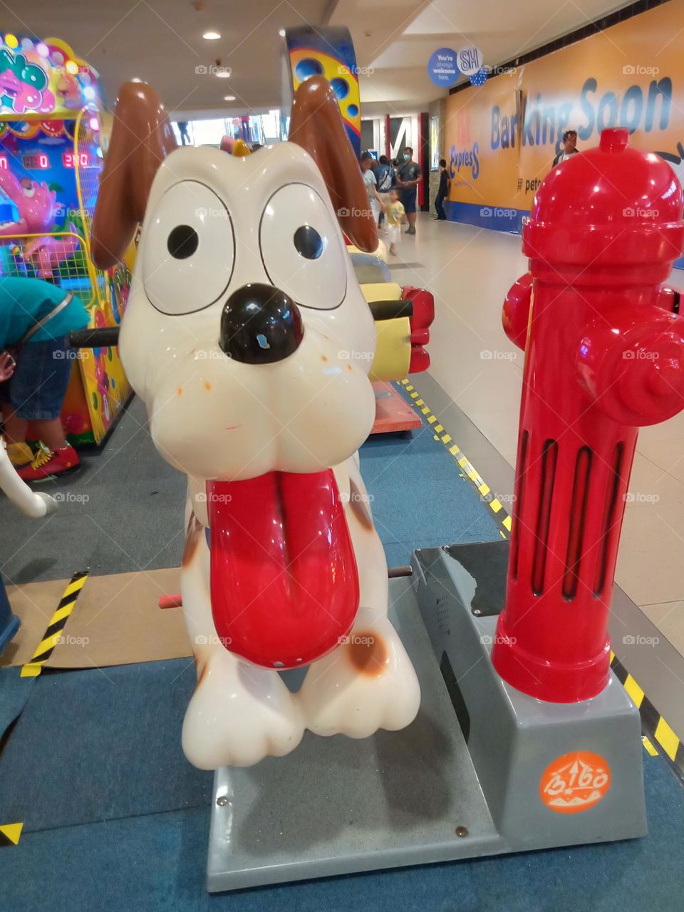 DOG RIDES FOR KIDS , CASH IN EXCHANGE FOR TOKEN FOR THIS TO MOVE,  AT THE SM CITY,,  COLORFUL