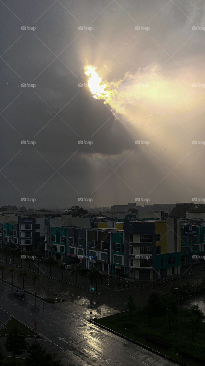 Sun ray through rainy clouds