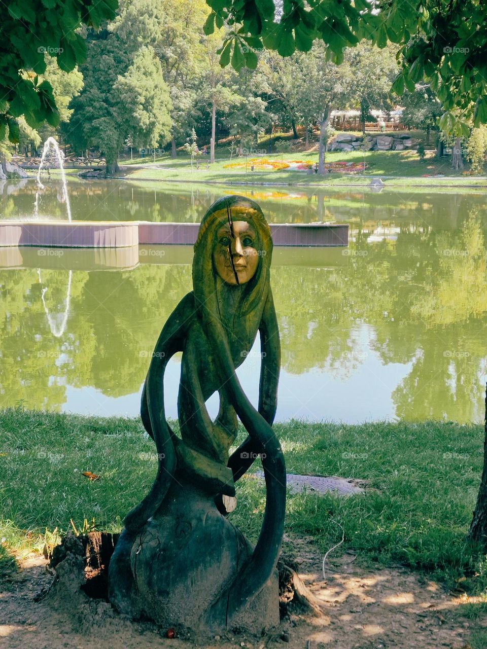 wood sculpture, green girl