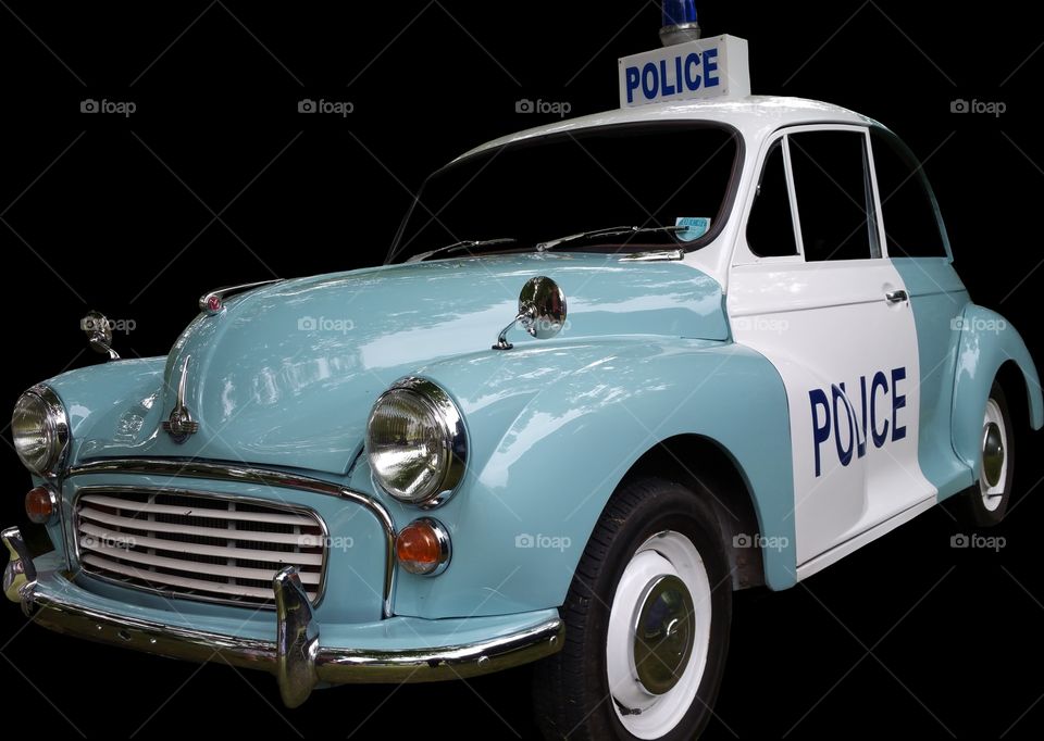 isolated on black,  vintage 1960s British police car.