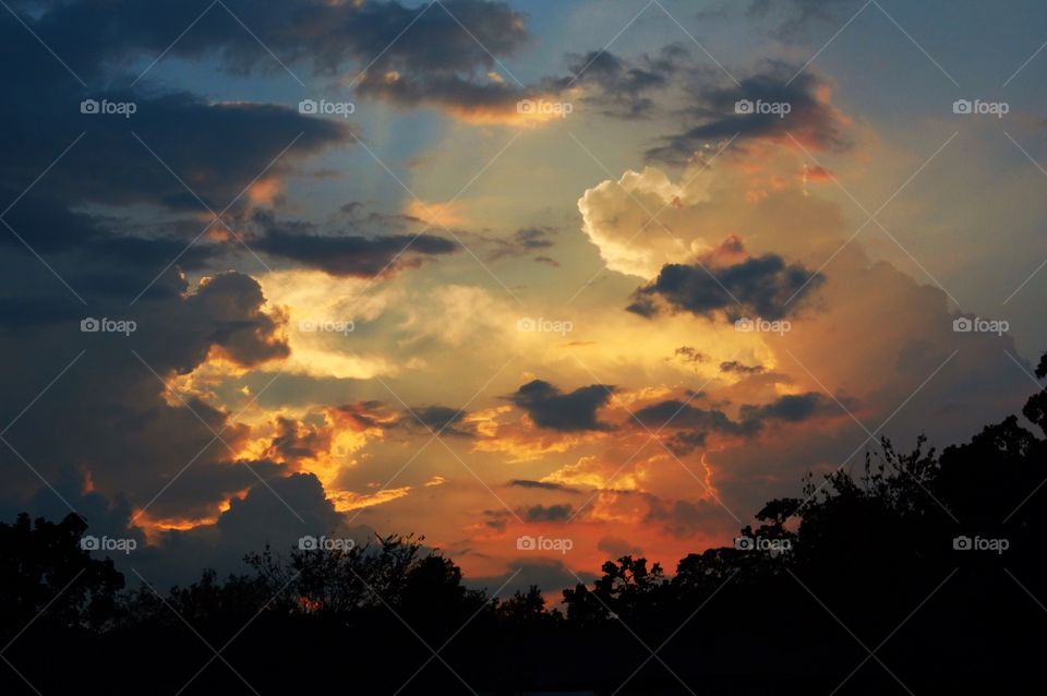 Sun rays through clouds during a storm 