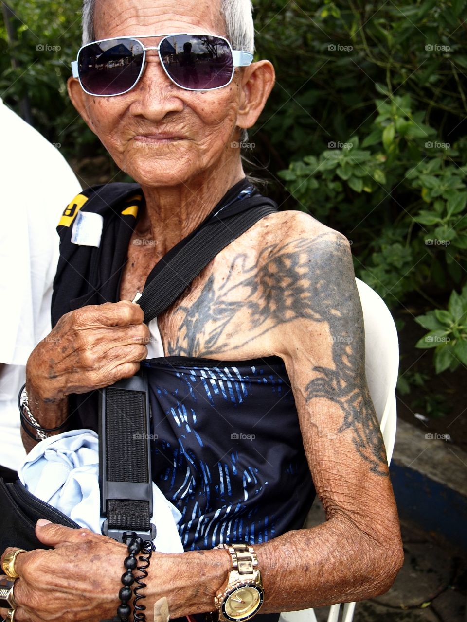 portrait of an old man with tattoos