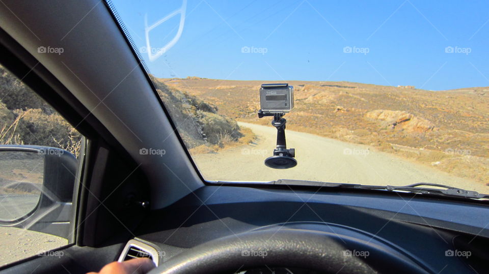 Driving on a dirt road. with a rented car using a go pro hero to
document the adventure of speeding on the countryside