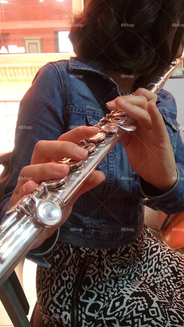 Music is everything. A student is playing the flute