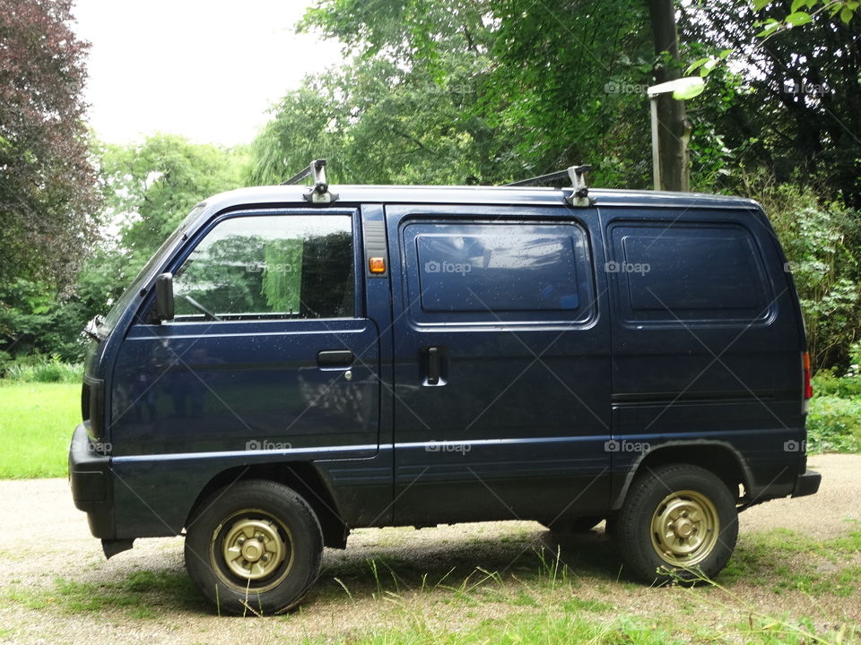 Old fashioned dark blue van 