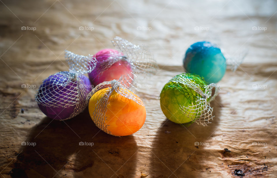 colorful Easter eggs on rustic background