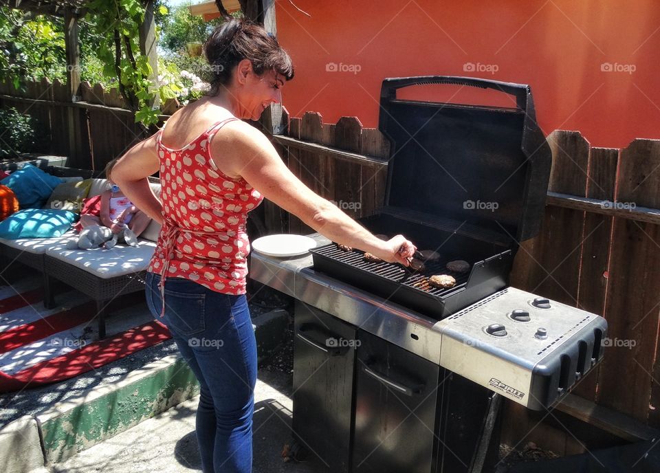 California Mom Cooking Meat On The BBQ