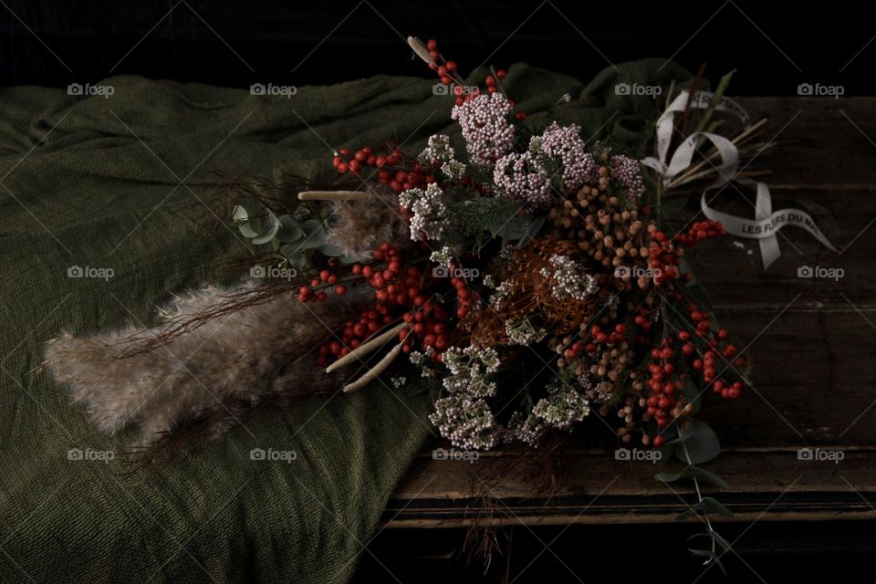 Accepted flowers are laying on the table. Is girl happy to get them? Will she care about the bouquet? Depends on person who sent them. 