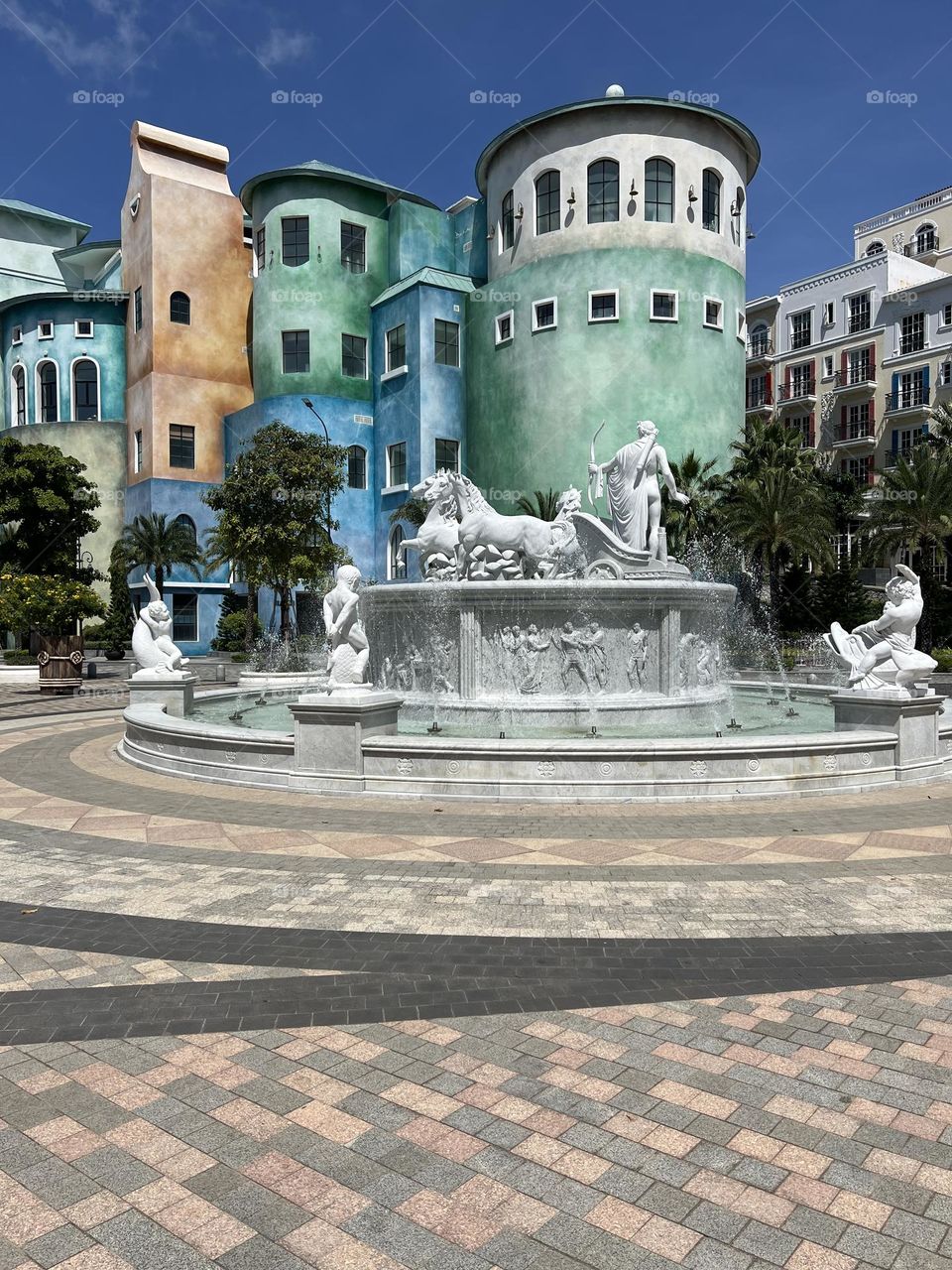 Street photography. Architecture. Colourful buildings. Fountain in Phu Quoc, Vietnam. 