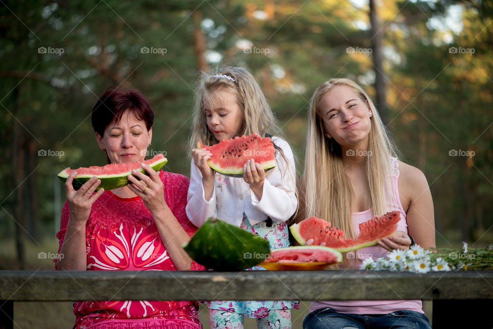 People eating watermelon