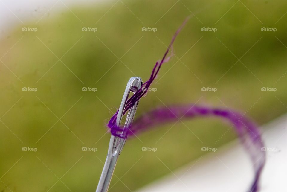 Close-up of needle with thread