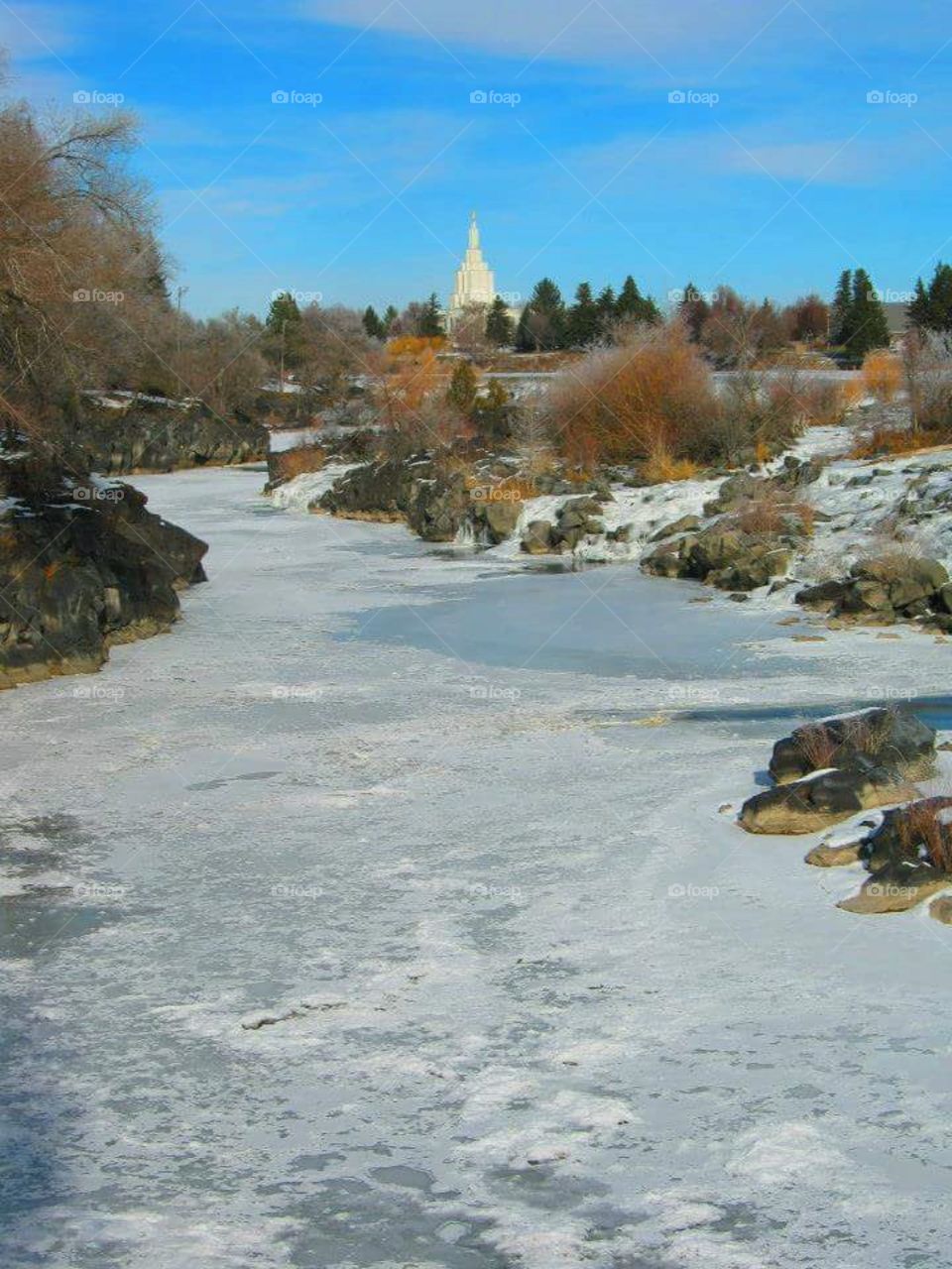 The Idaho Falls with the LDS Idaho Falls Temple in the background
