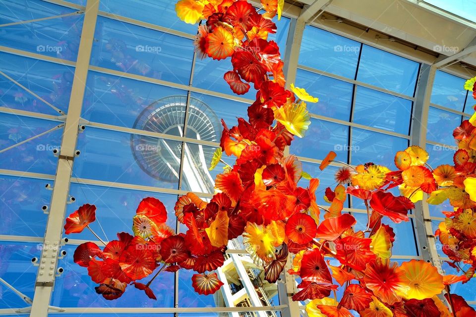 The Seattle Space Needle view through the windows of the Chihuly museum. 