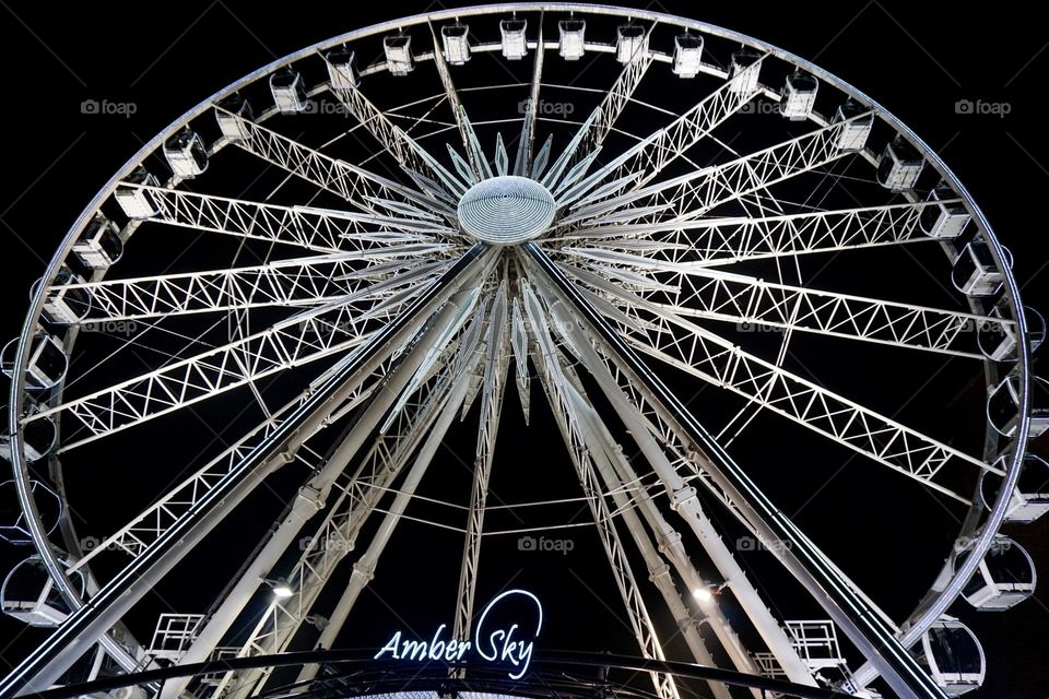 Ferris wheel at night lit it beautifully