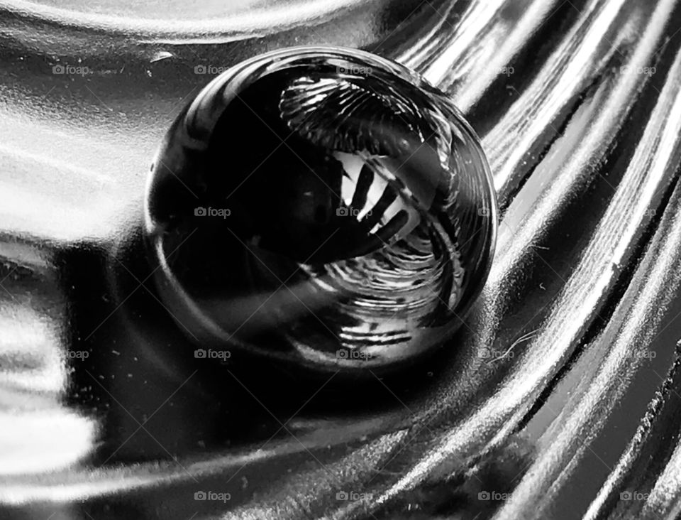 Black and white abstract using marbles, fluted metal, my hand, and reflected light. Im loving creating abstracts!!!!