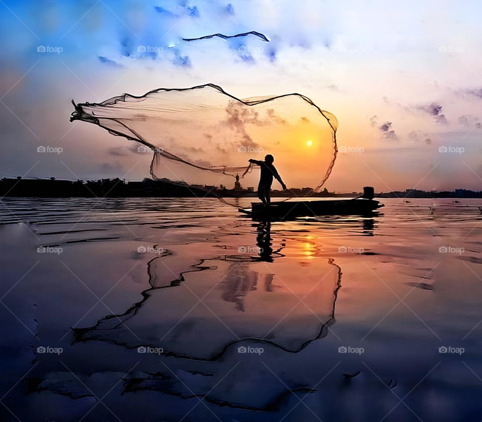 A fisherman is swinging his net to catch fish.