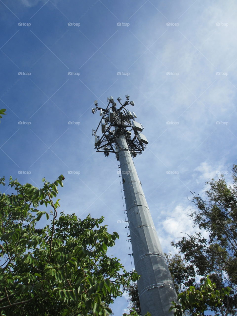 microwave tower. looking up at a microwave / communication tower