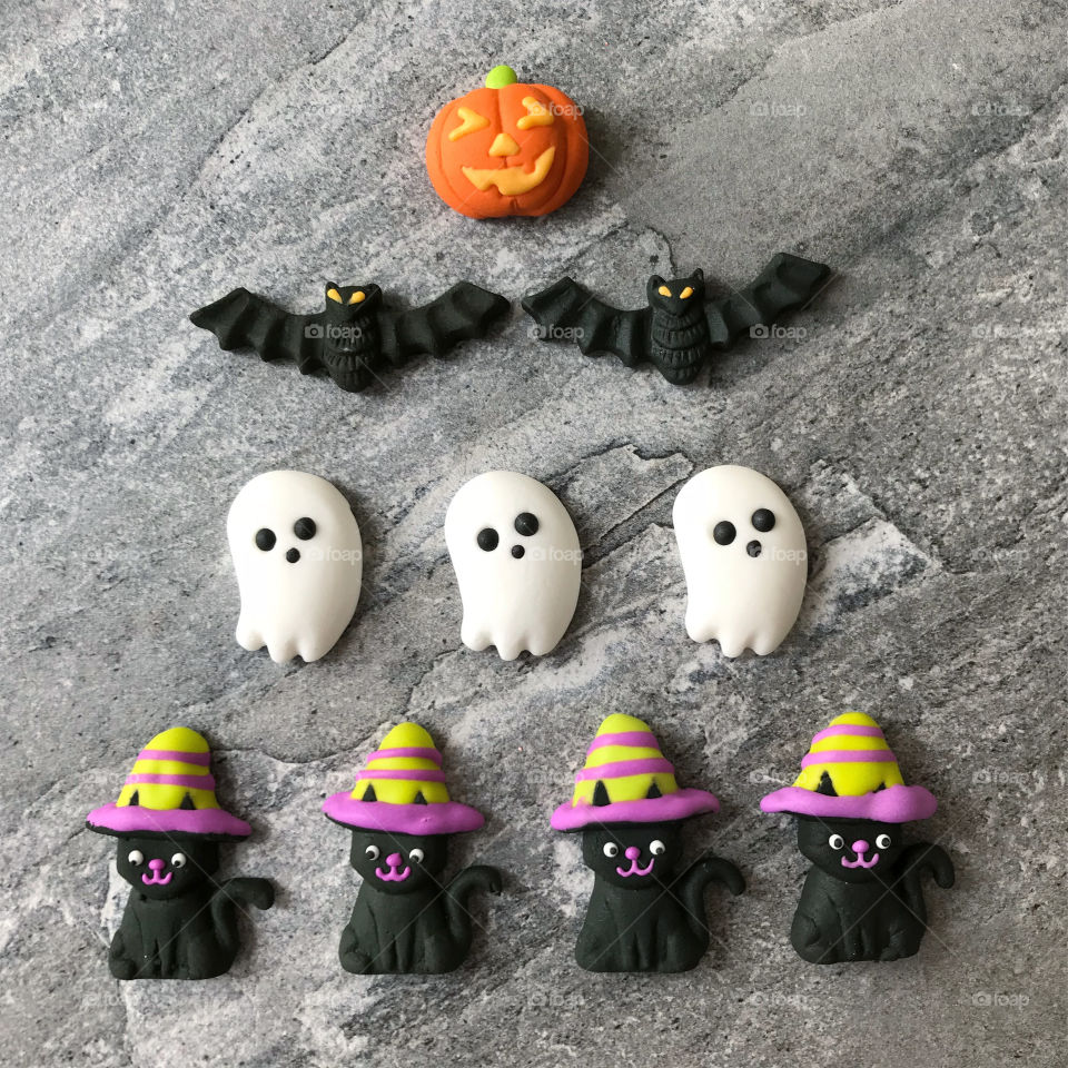 Looking down on a festive Halloween display of decorating items used for cupcakes 