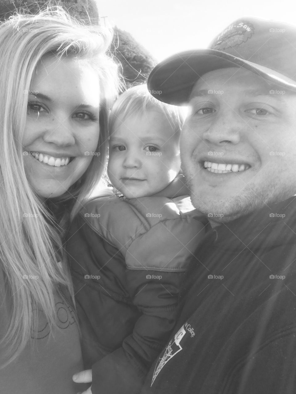 Close-up of a little kid with mother and father