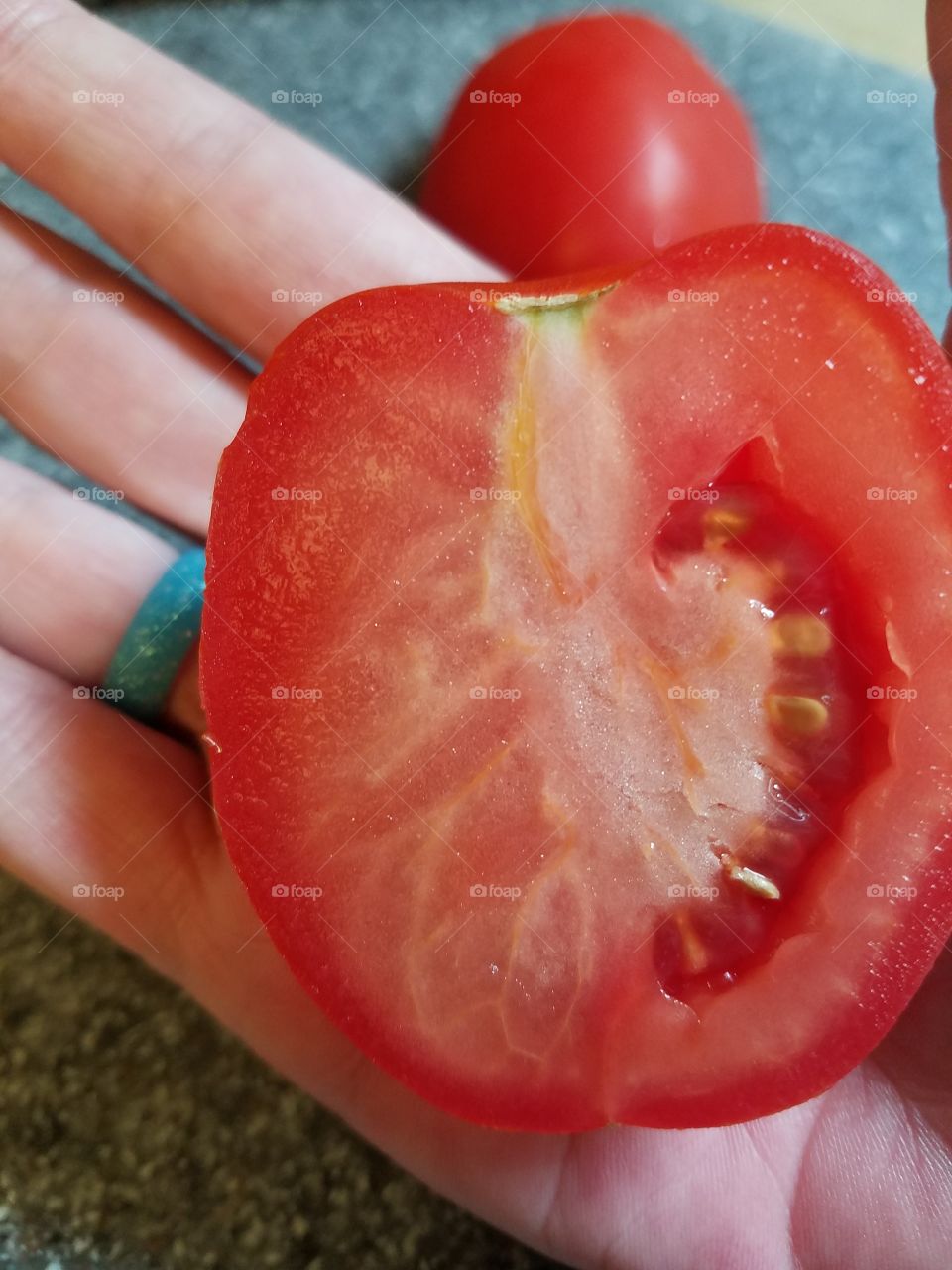 Holding food  tomato 2