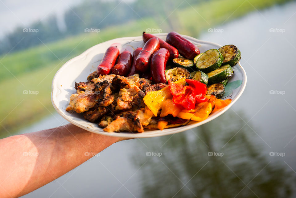 Grilled sausages and vegetables on a plate