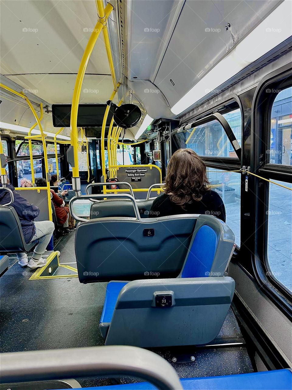 This is the sleek new interior of the redesigned modern “Municipal Transit Authority” “B43” bus that I am currently riding back to “Greenpoint”, the “Pulaski Bridge” and “Newtown Creek” from “Bushwick”, Brooklyn. 2024. Hypnotic Productions