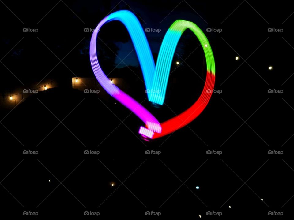 LED lighting cube and a long exposure creates a heart shaped pattern during a night shoot
