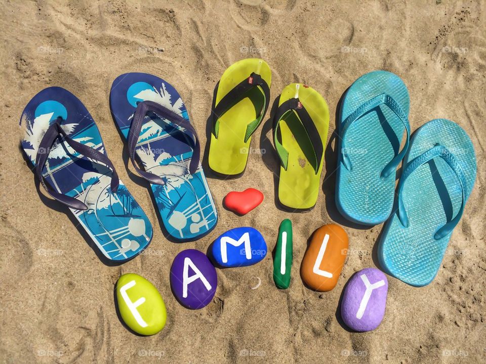 Painted pebble stone and slippers