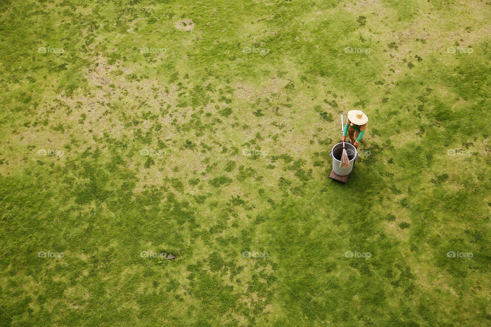 A person standing on grassy land