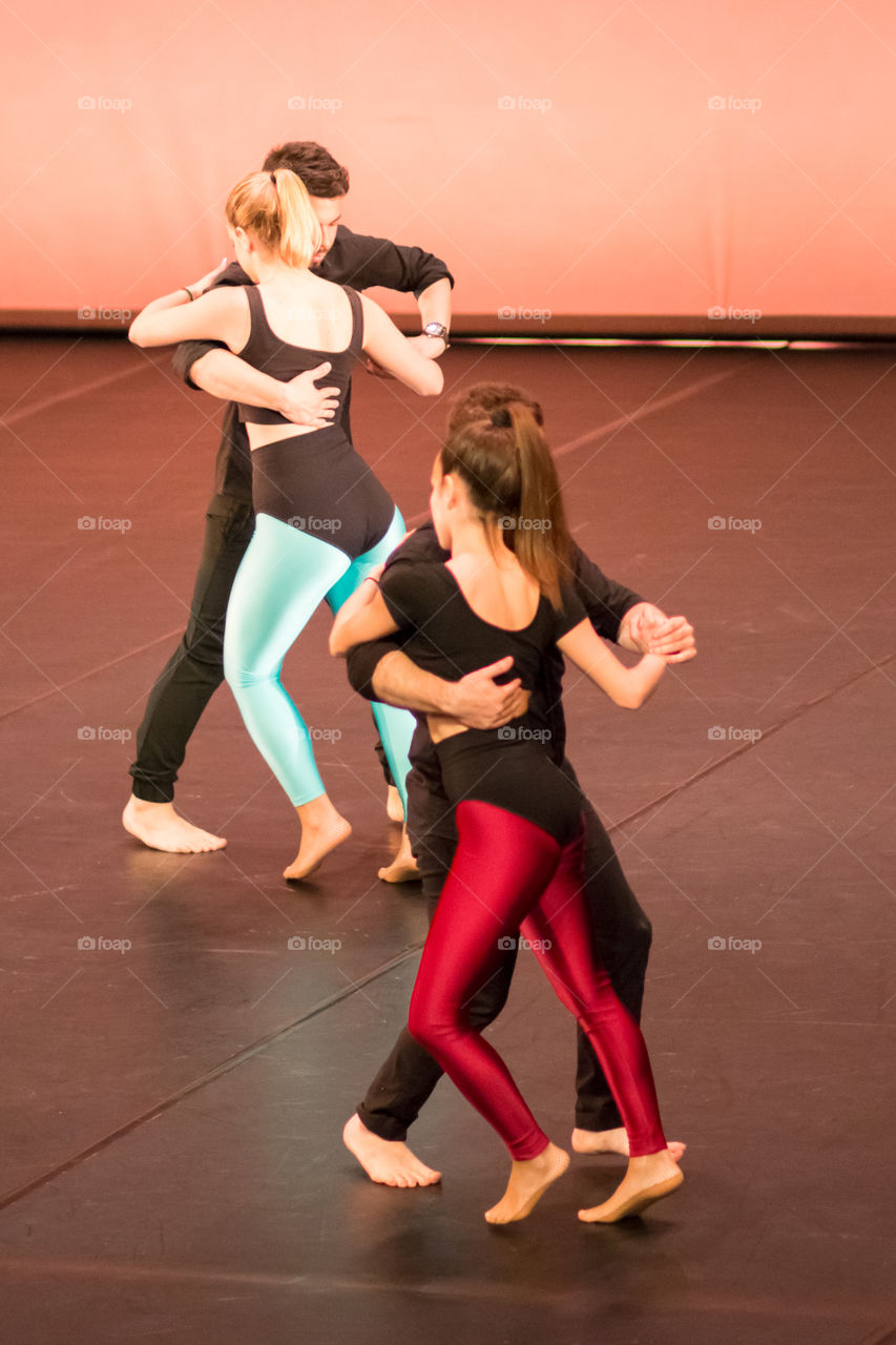 Young Couples Modern Dancers Performers In Action In Stage
