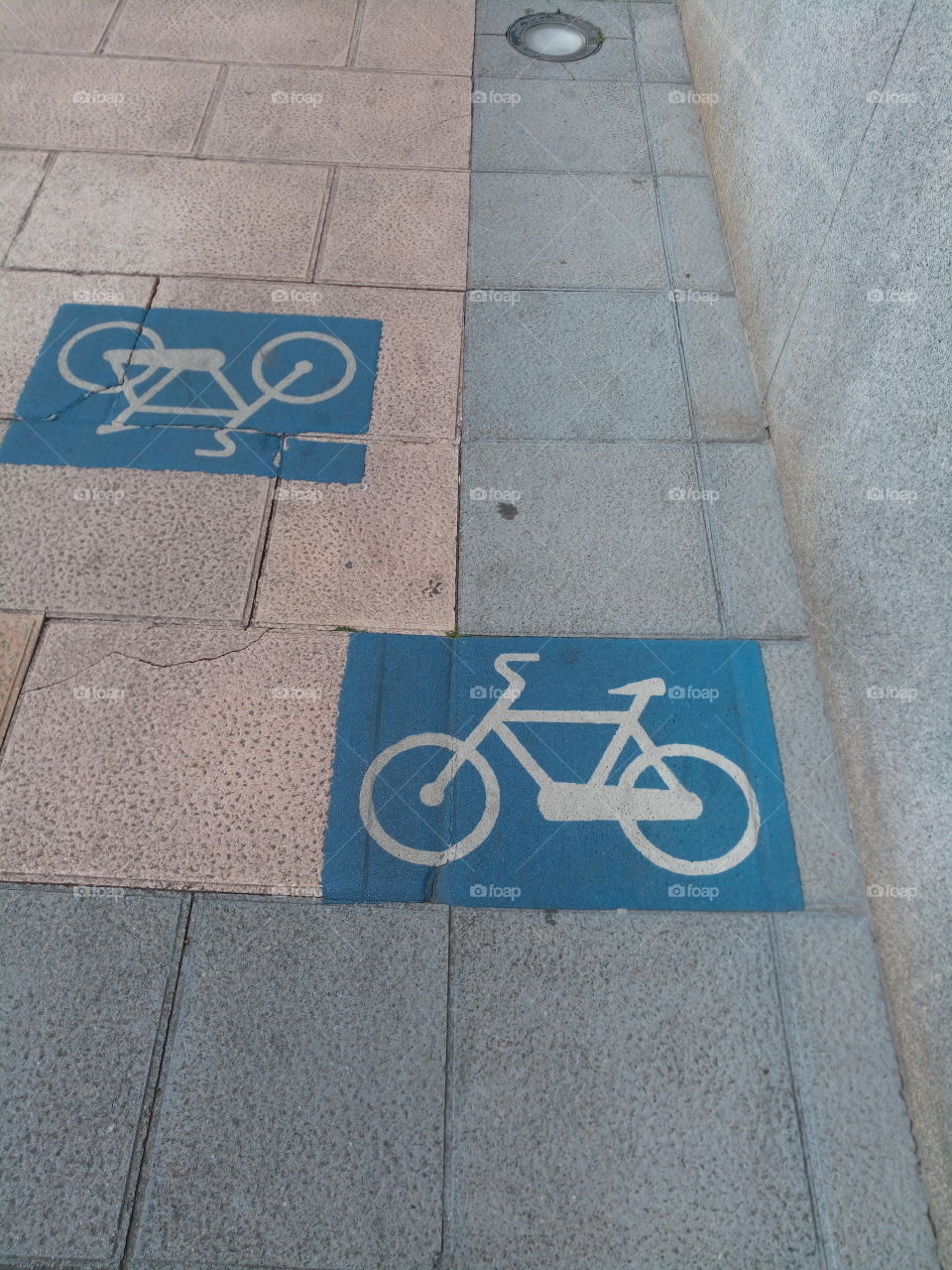 bicycle lane signs on the sidewalk II