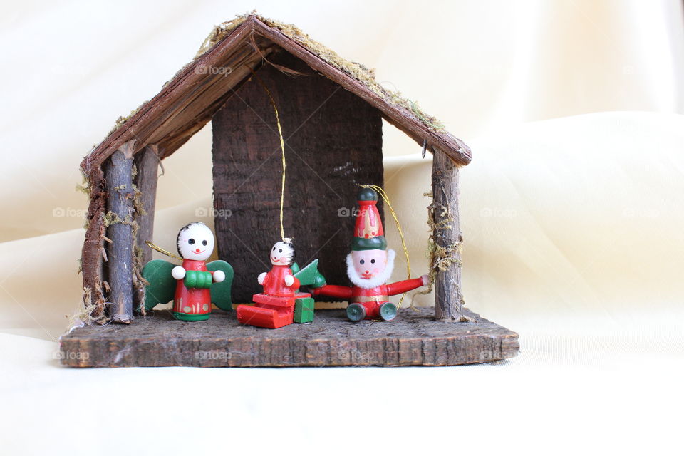 miniature toy house with Christmas figurines