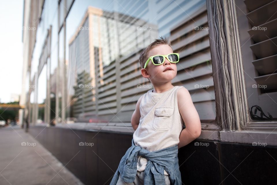 Urban Kid. Young boy staring into a downtown skyline