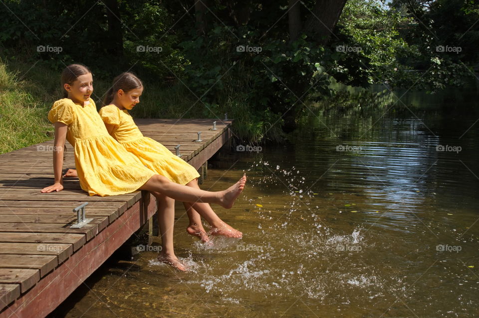 Two girls by the river