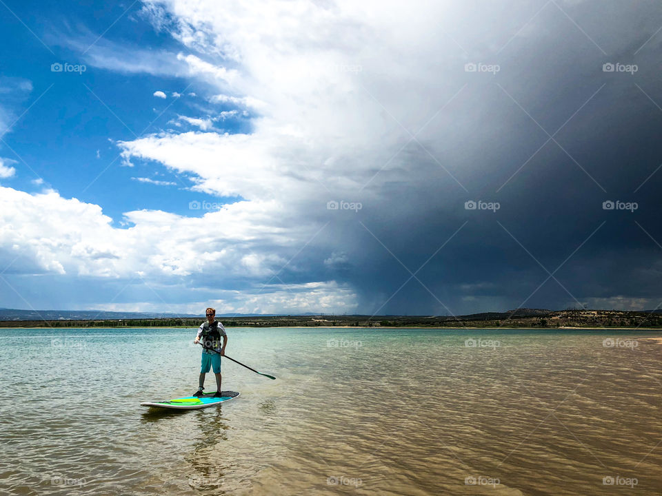 Paddle boarder enjoying his time on the lake before a storm rolled in. 