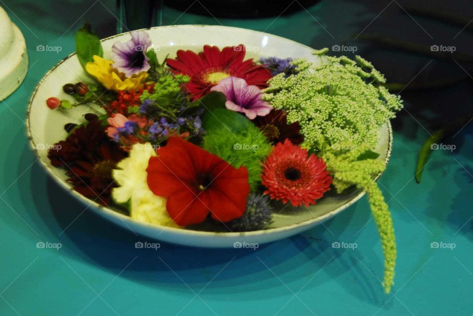 an arrangement full of colorful flowers