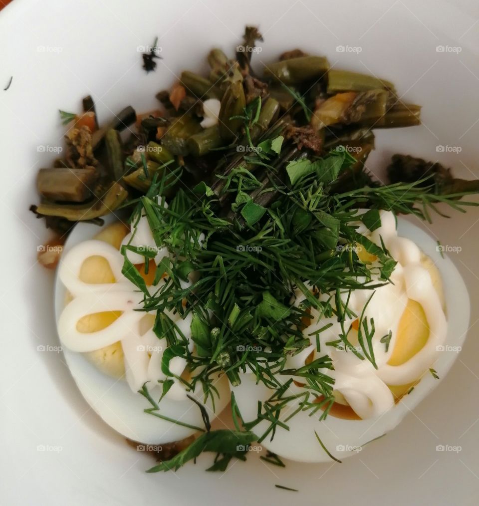 Salad with egg, fern, greens and mayonnaise