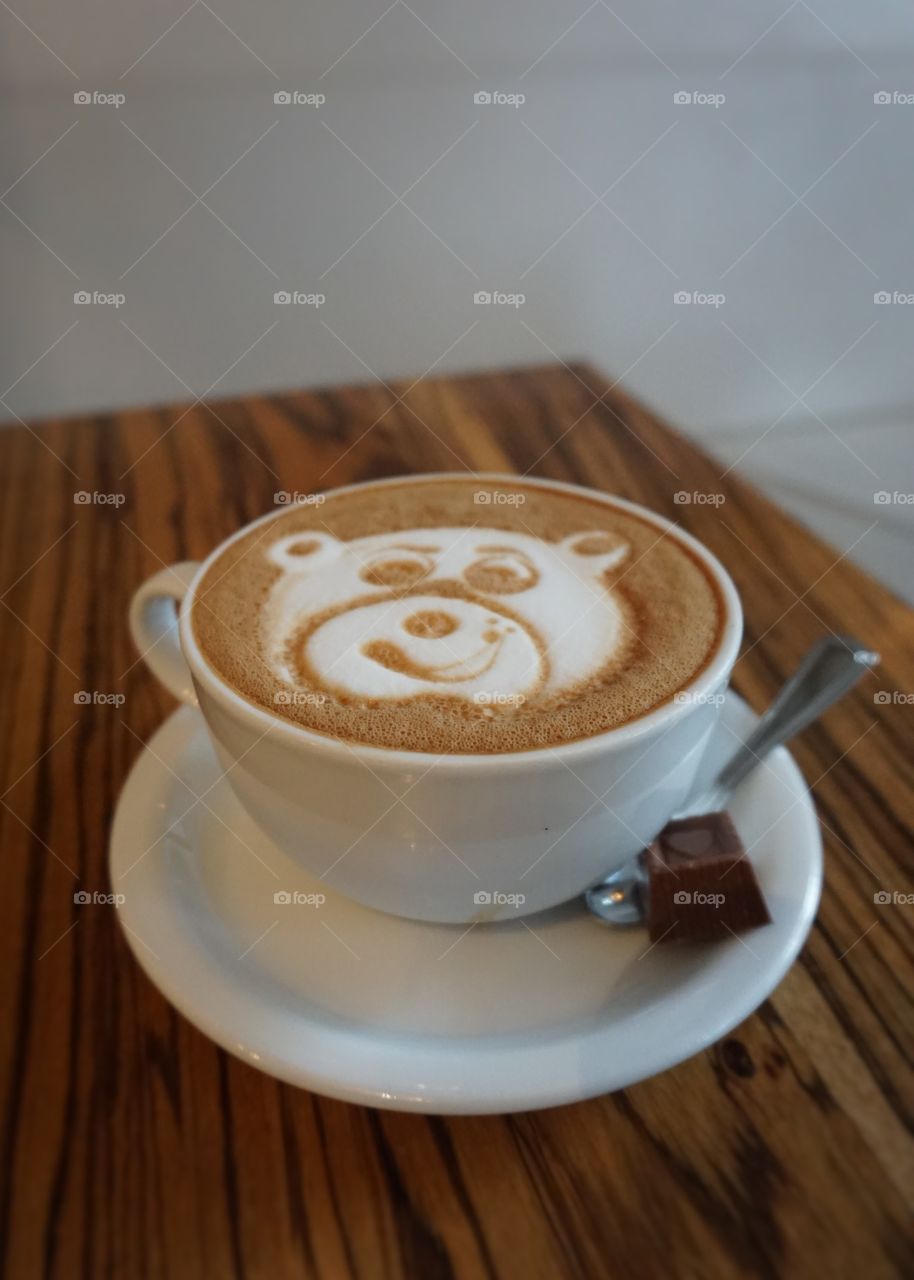 A cup of coffee latte art like bear face